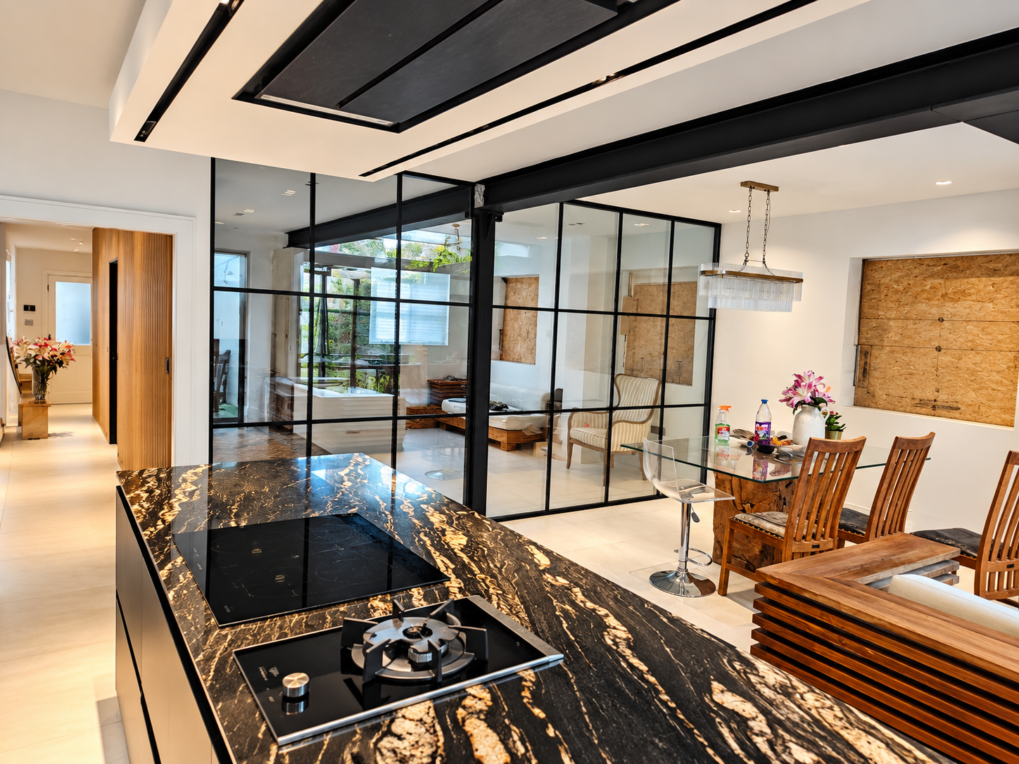 Black-framed double-glazed partition between kitchen and dining space in Battersea