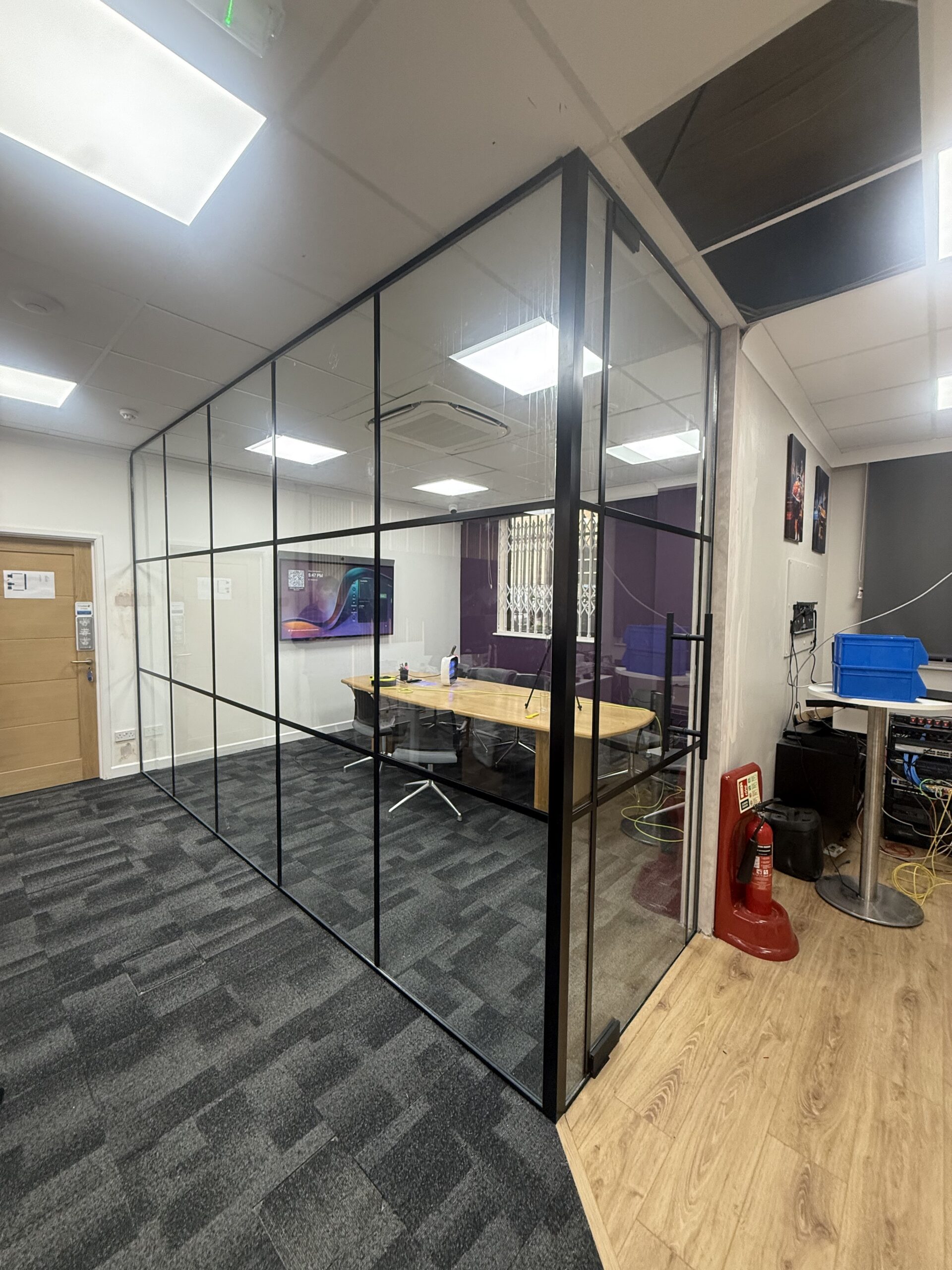 Black framed Crittall-style office glass partition installation in West London
