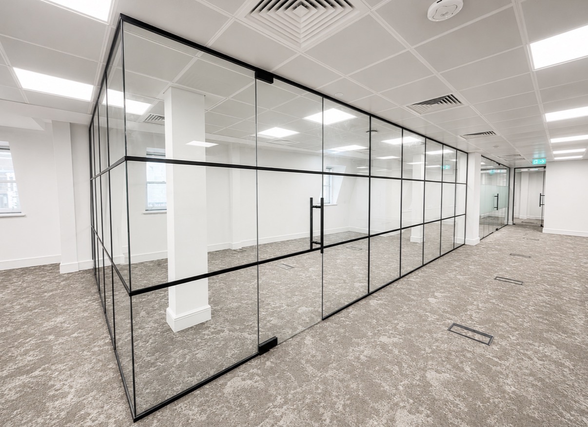 Full-floor internal glass partitions with black frames at Minories in the City of London