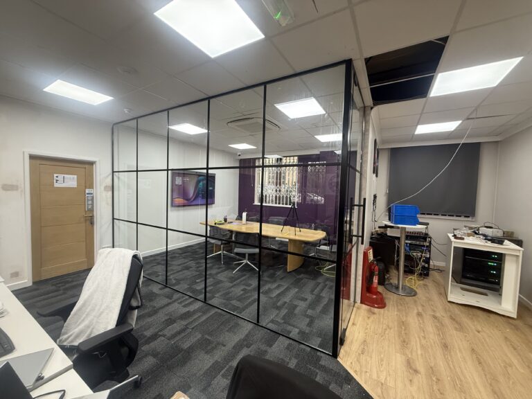 Completed office meeting room created with Crittall-style glass partitioning in West London