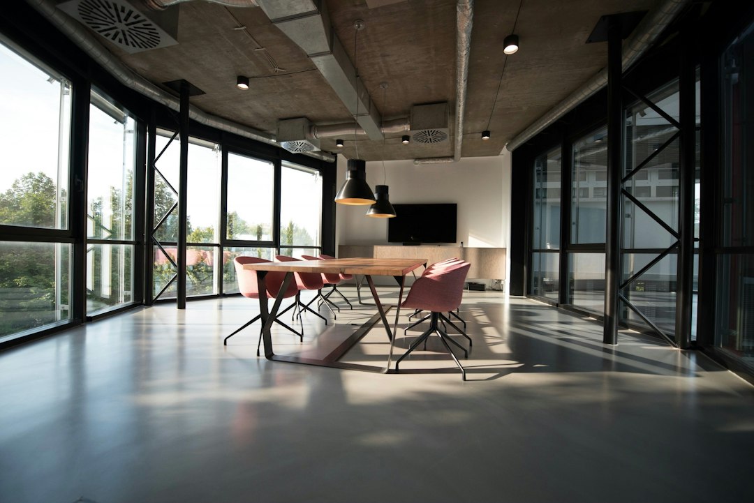 Modern glass office meeting room with glazed partitions